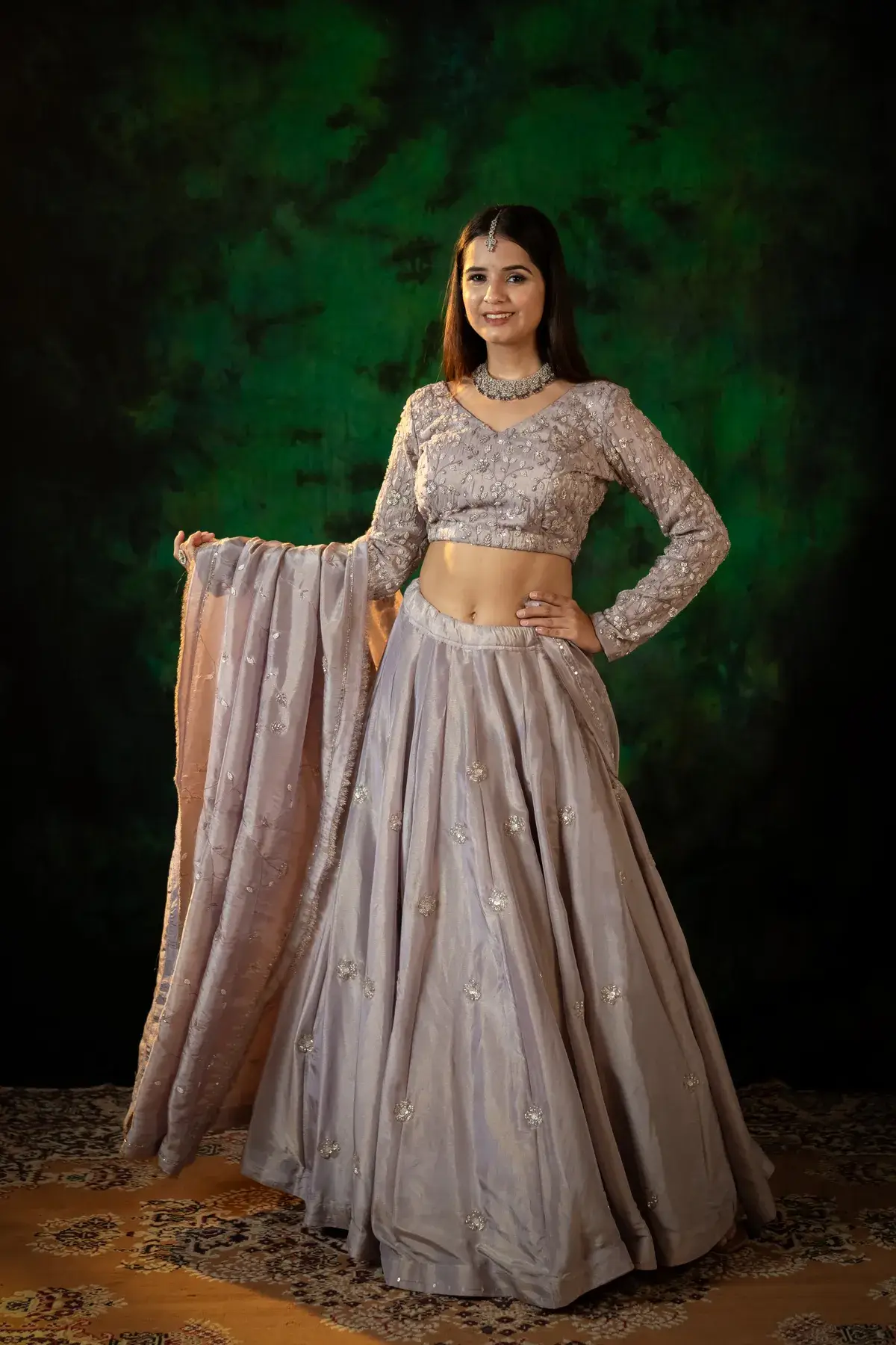 Mauve tissue and hand-set sequins — the reception look.